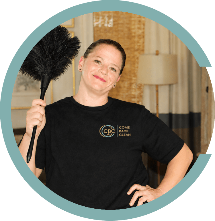 Come Back Clean cleaner holding a feather duster