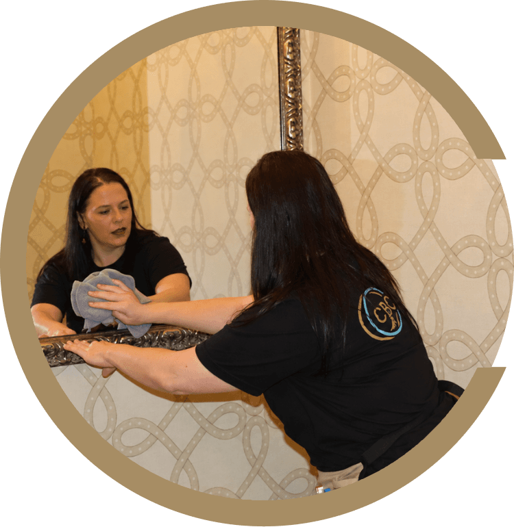 Come Back Clean cleaner wiping a mirror